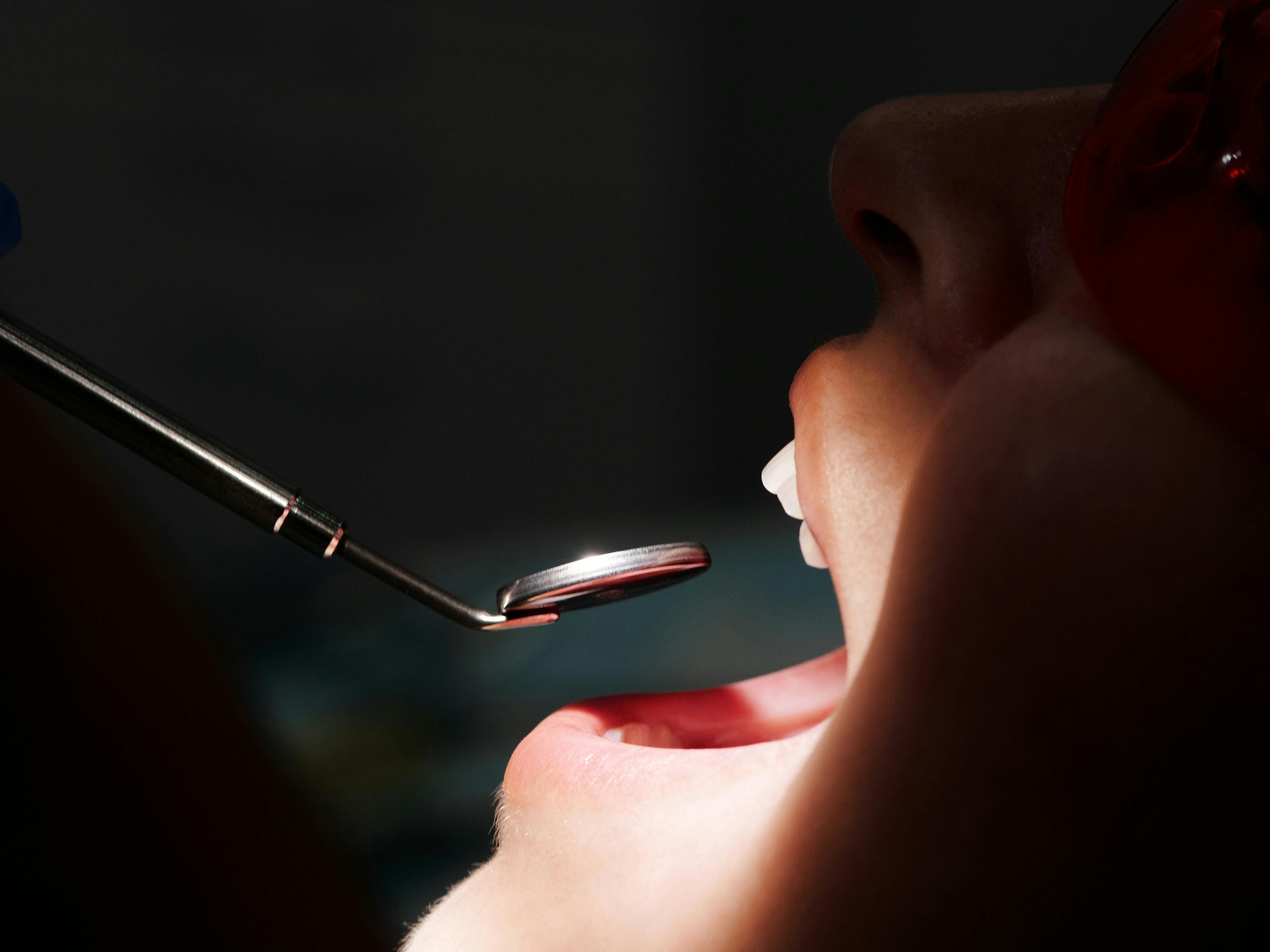 Patient speaking with the Lux Dentistry team