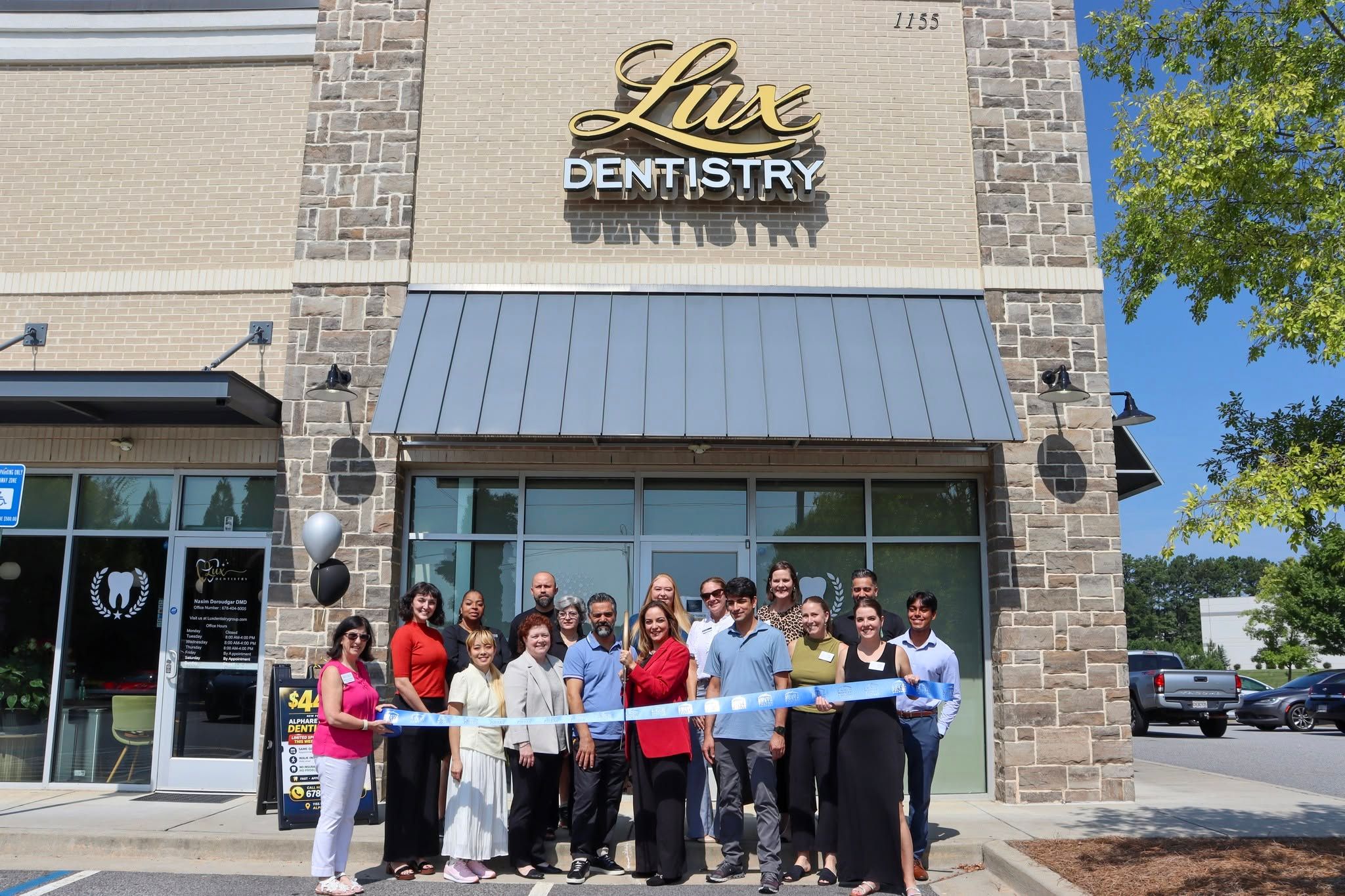 Dr. Doroudgar and community members at the Lux Dentistry ribbon cutting
