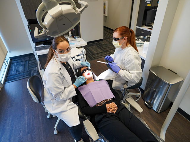 What professional dental cleanings remove at Lux Dentistry Alpharetta