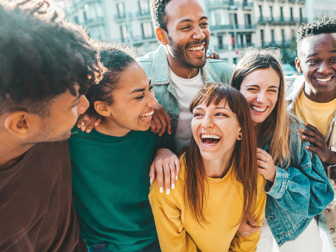 Invisalign patient smiling with friends